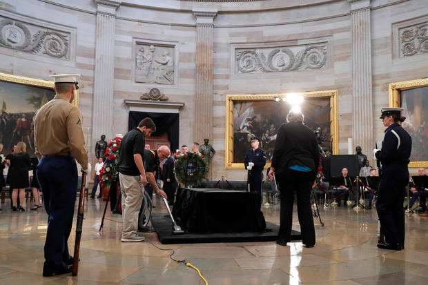 Members of a military choir await the beginning of ceremonies for the late former U.S. President George H.W. Bush inside the U.S. Capitol rotunda in Washington 