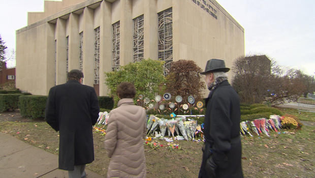 A memorial outside the Tree of Life synagogue in Pittsburgh, where a man armed with an AR-15 rifle and three handguns opened fire in October, killing 11 and wounding six. CBS NEWS