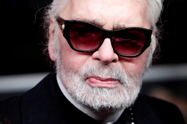 FILE PHOTO: German designer Karl Lagerfeld poses after officially switching on the Christmas lights on the Champs-Elysees avenue in Paris 