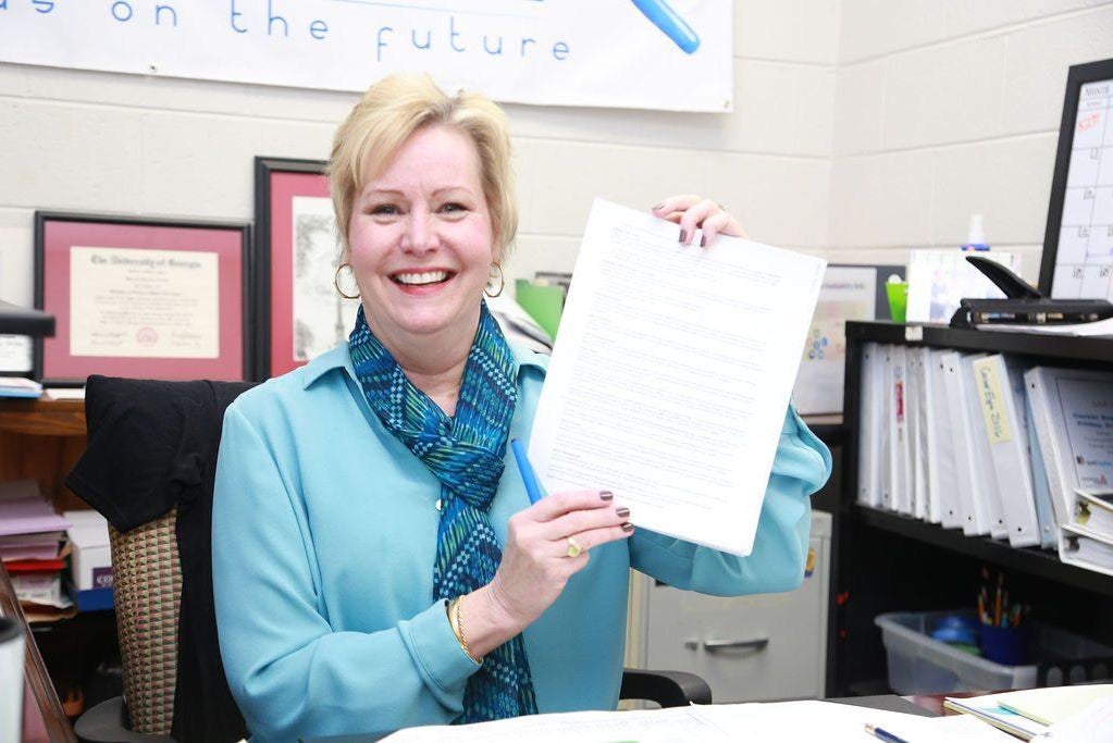 woman reads fine print on travel insurance policy