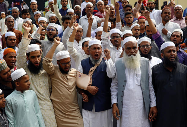 Muslims shout slogans as they condemn the Christchurch mosque attack in New Zealand, after Friday prayers at the Baitul Mukarram National Mosque in Dhaka 