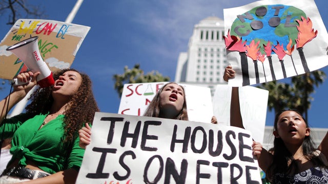 Students attend a protest rally to call for urgent action to slow the pace of climate change, in Los Angeles 