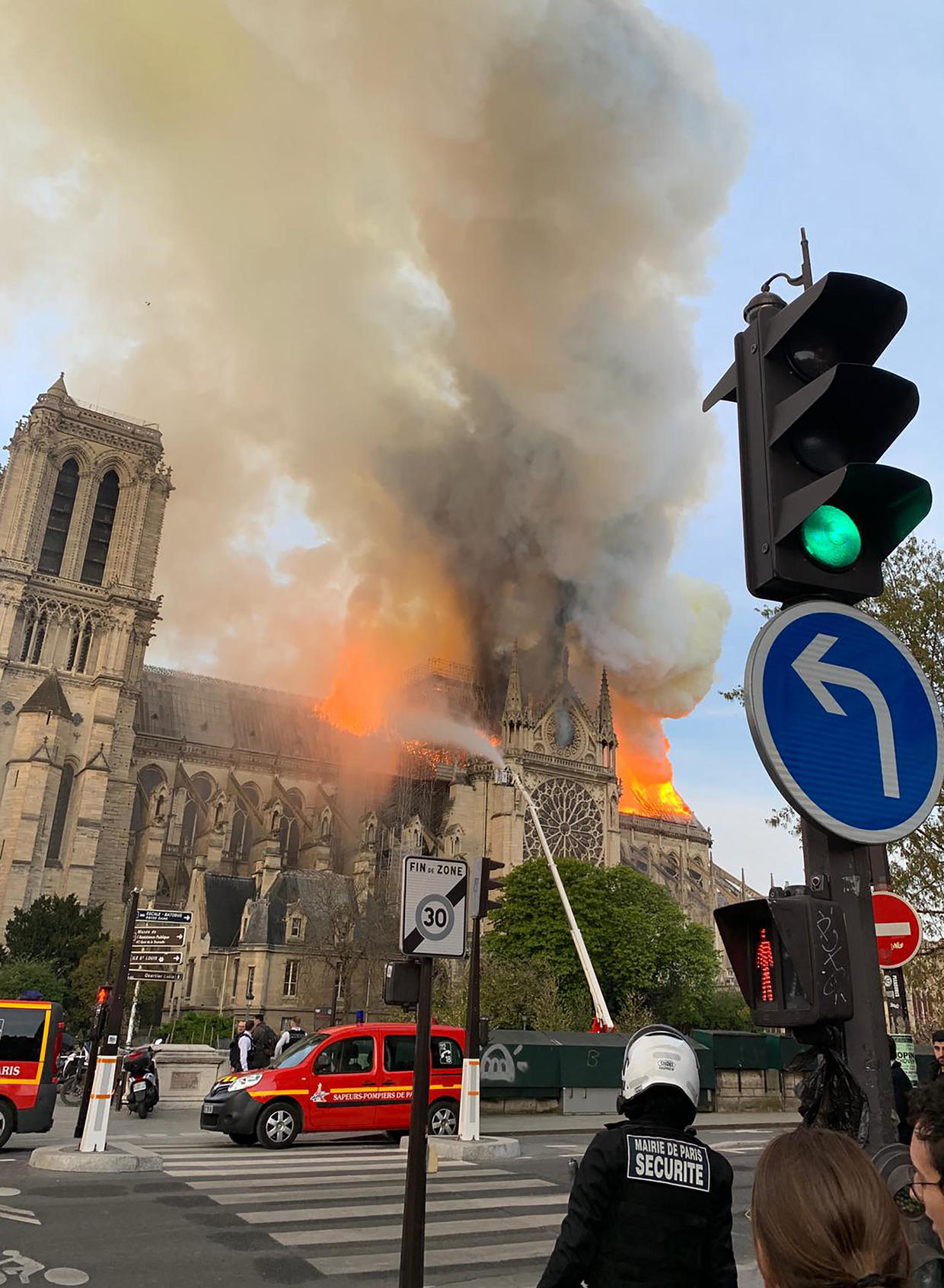 notre dame fire man on roof