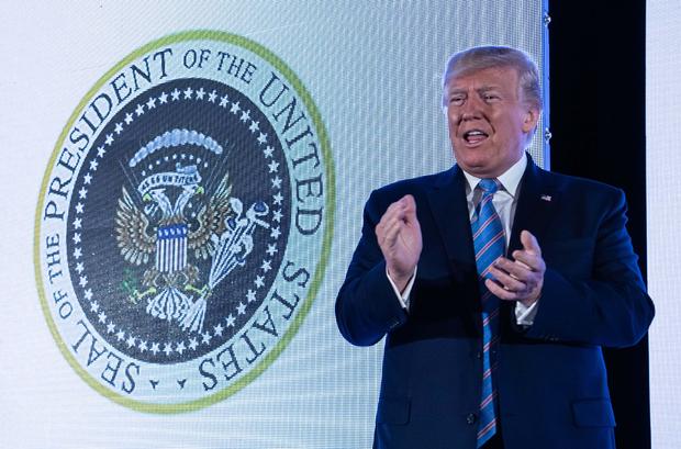 Trump appears in front of altered presidential seal saying ’45 is a puppet’