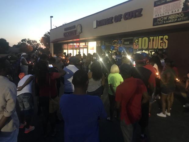 Candlelight vigil for Fredrick Myers outside his barber shop 