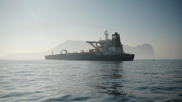 FILE PHOTO: Iranian oil tanker Grace 1 sits anchored after it was seized in July by British Royal Marines off the coast of the British Mediterranean territory, in the Strait of Gibraltar