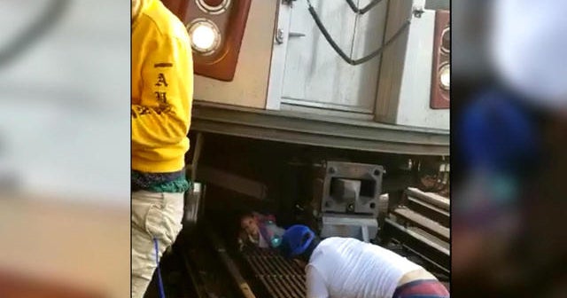 Girl saved after father jumps in front of subway train CBS News