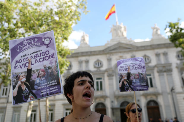 Women gather outside the Supreme Court after Spain's top court found five men known as the "Wolf Pack" guilty of rape in Madrid 