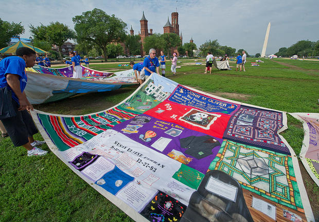 Volunteers lay out the AIDS Quilt on the 