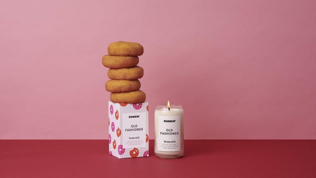 A cup of Dunkin' Donuts coffee and a doughnut bag sit on a counter Sept. 7, 2006, in Chicago, Illinois. 
