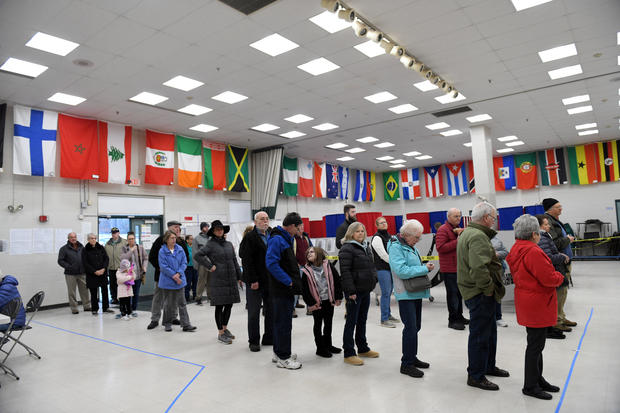 Voters wait in line to cast their votes at the Bicentennial Elementary School in New Hampshire's first-in-the-nation U.S. presidential primary election in Nashua 