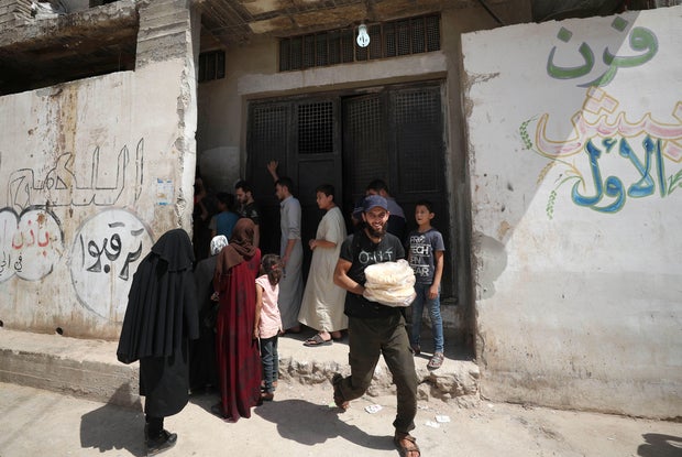 SYRIA-CONFLICT-CURRENCY-ECONOMY