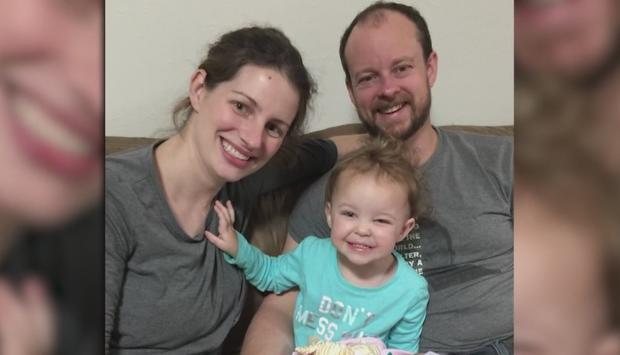 Jason and Meaghan Helms with their daughter 