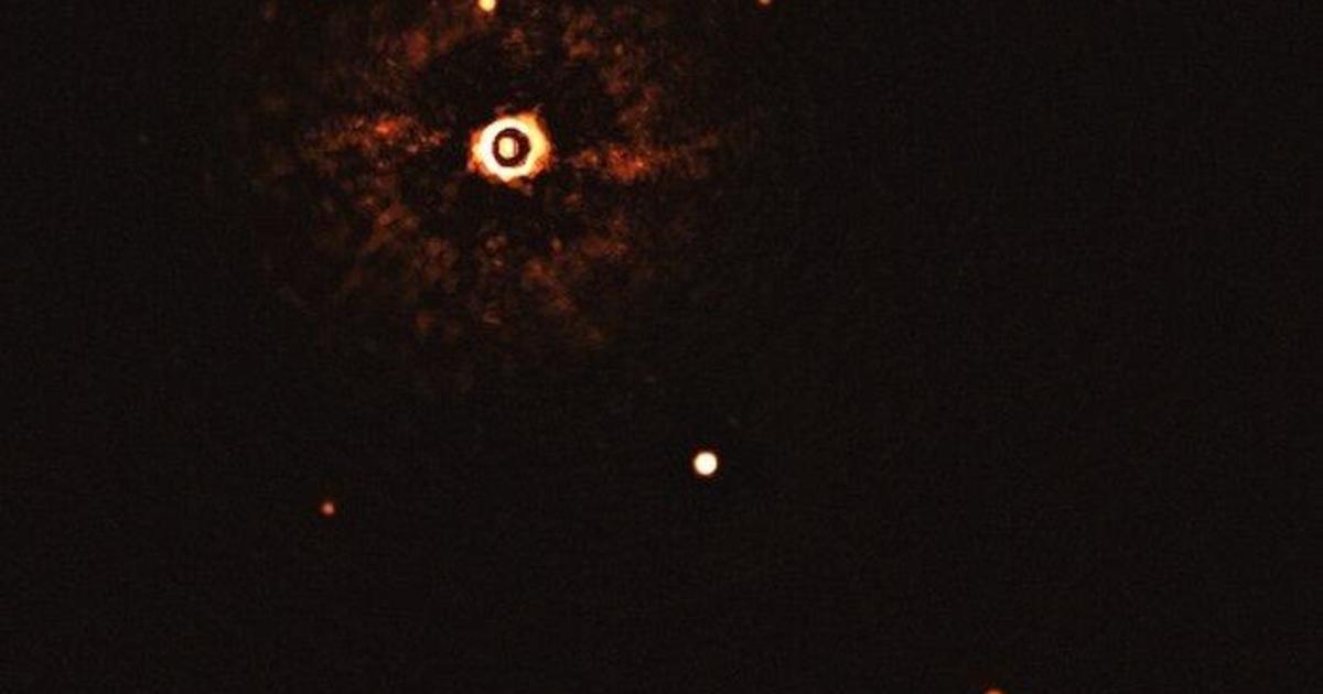 Scientists reveal first-ever photo of a solar system like ours