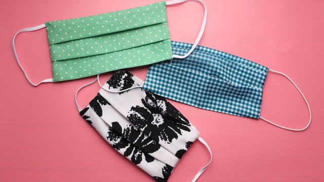 Homemade Cotton Face Mask For Preventing Virus On Pink Background . 