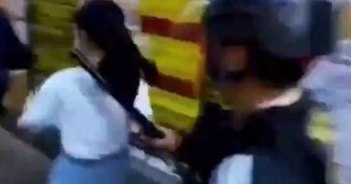 Hong Kong Police Criticized After Video Shows Officers Tackle 12 Year Old Girl Cbs News