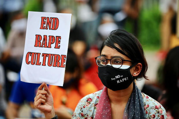A feminist group take part in an ongoing protest demanding justice for the alleged gang rape of a woman 