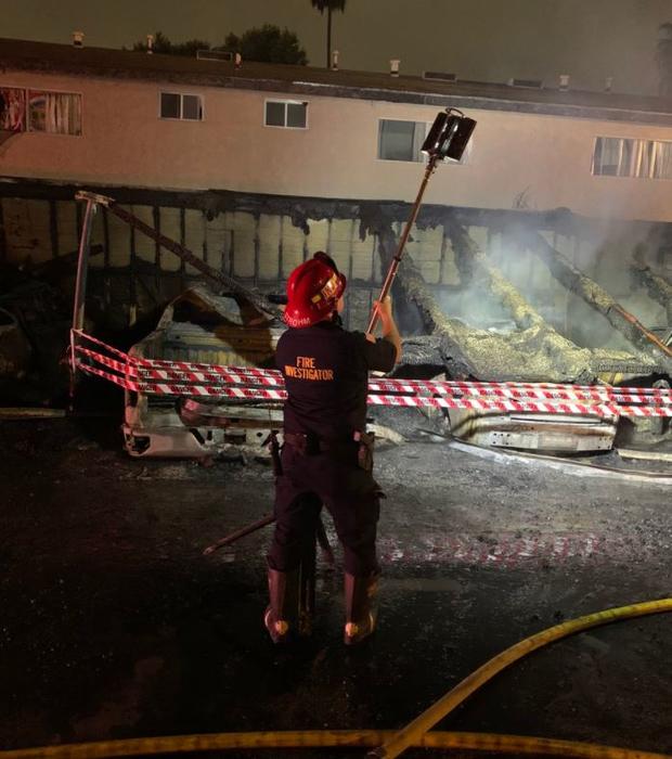 Fire Rips Through Apartment Carport In Tustin, Several Cars Damaged 