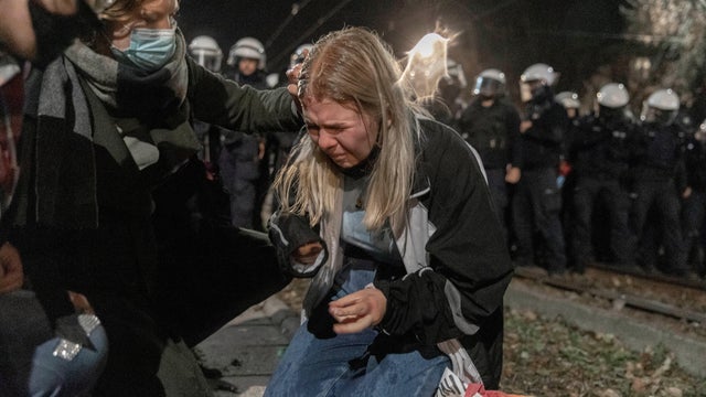 People block a street near the house of Law and Justice leader Jaroslaw Kaczynski during a protest against imposing further restrictions on abortion law in Warsaw