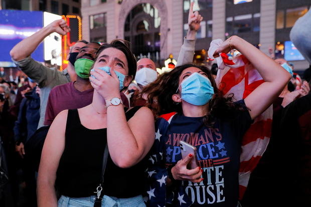 People celebrate in Times Square in New York City 
