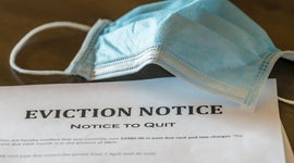 Official legal eviction order or notice to renter or tenant of home with face mask 