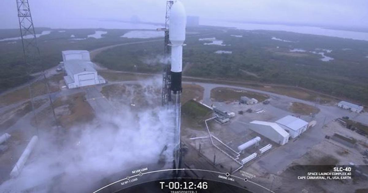 Spacex Falcon 9 Rocket With 143 Satellites Grounded By Weather Cbs News