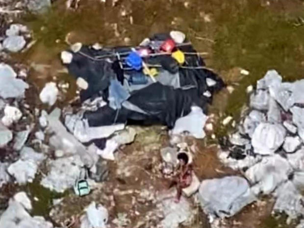 An aerial photo shows a makeshift shelter for three people stranded on Anguilla Cay, Bahamas, February 8, 2021. 