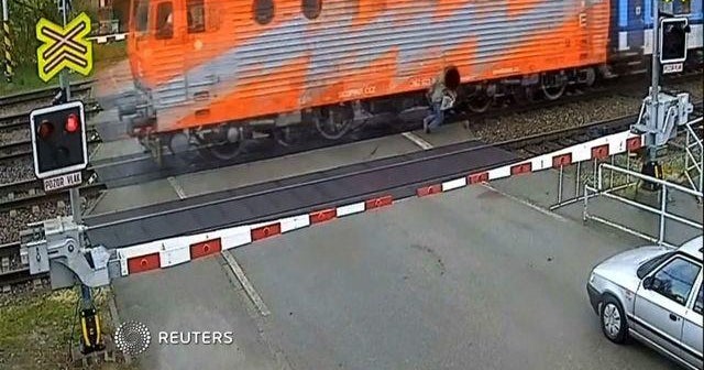 Watch: Man walks away after being hit by train