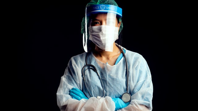 doctor in PPE suit uniform has stress in Coronavirus outbreak  and Emotional stress of overworked doctor and medical care team during covid-10 period. 
