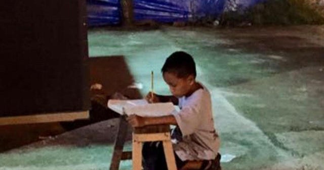 Picture of homeless student doing homework goes viral