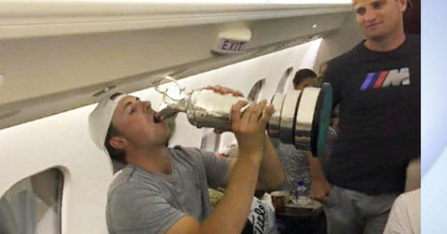 British Open Champ, rival chug from trophy