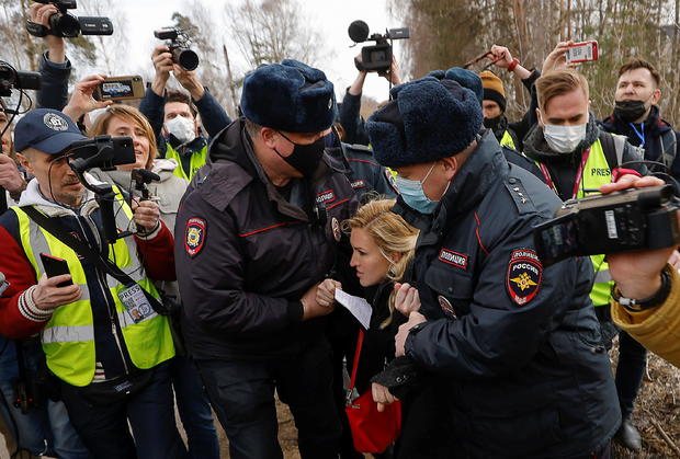 Russian police officers detain Anastasiya Vasilyeva, a doctor and ally of Kremlin critic Alexei Navalny, near the IK-2 corrective penal colony in Pokrov 