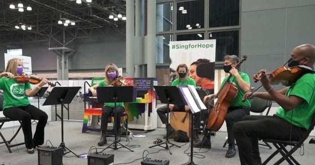 Musical artists back to work healing a country through music at vaccination sites