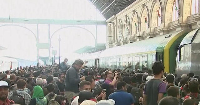 Migrants flood trains in Budapest as police blockade ends