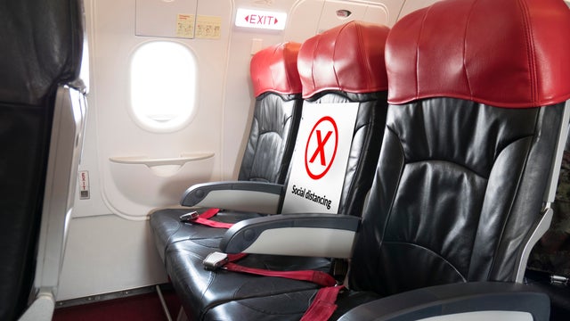 seat for passenger with space for each chair on airplane for physical distancing. airline policy about travel during coronavirus or covid-19 virus pandemic. new normal concept 