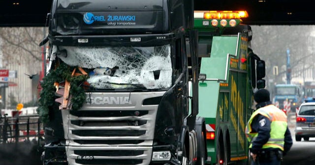 German police launch raids as terror suspect manhunt intensifies
