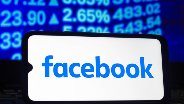 In this photo illustration a Facebook logo seen displayed on 