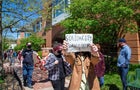Penn State graduate student, Ernest Tjia holds a "solidarity 