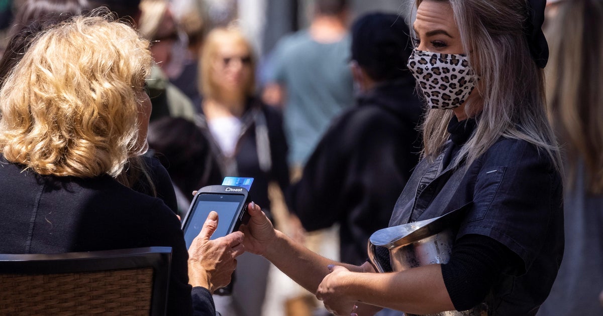 Nervous workers adjust to abrupt relaxation of mask policies