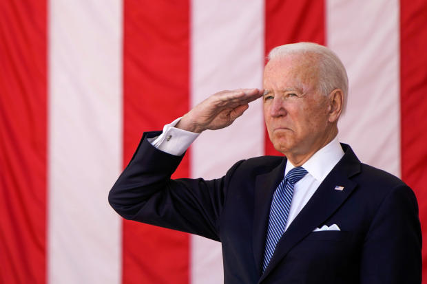 President Biden salutes during a Memorial Day observance at Arlington National Cemetery in Arlington, Virginia, May 31, 2021. 
