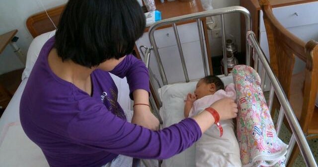 China eases birth limits, allowing three children per family to help boost aging population