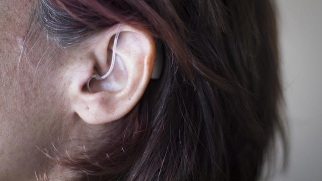Close-Up Of Woman Wearing Hearing Aid 