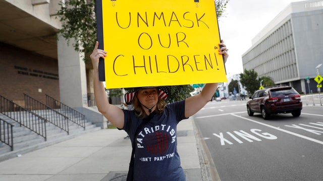 FILE PHOTO: People protest against the school mask mandate in Tampa 