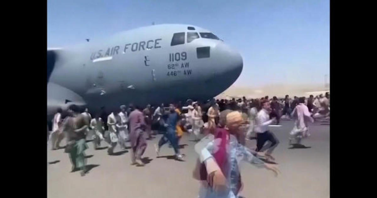 Air base holding evacuees filled to capacity as more Afghans try to escape the Taliban