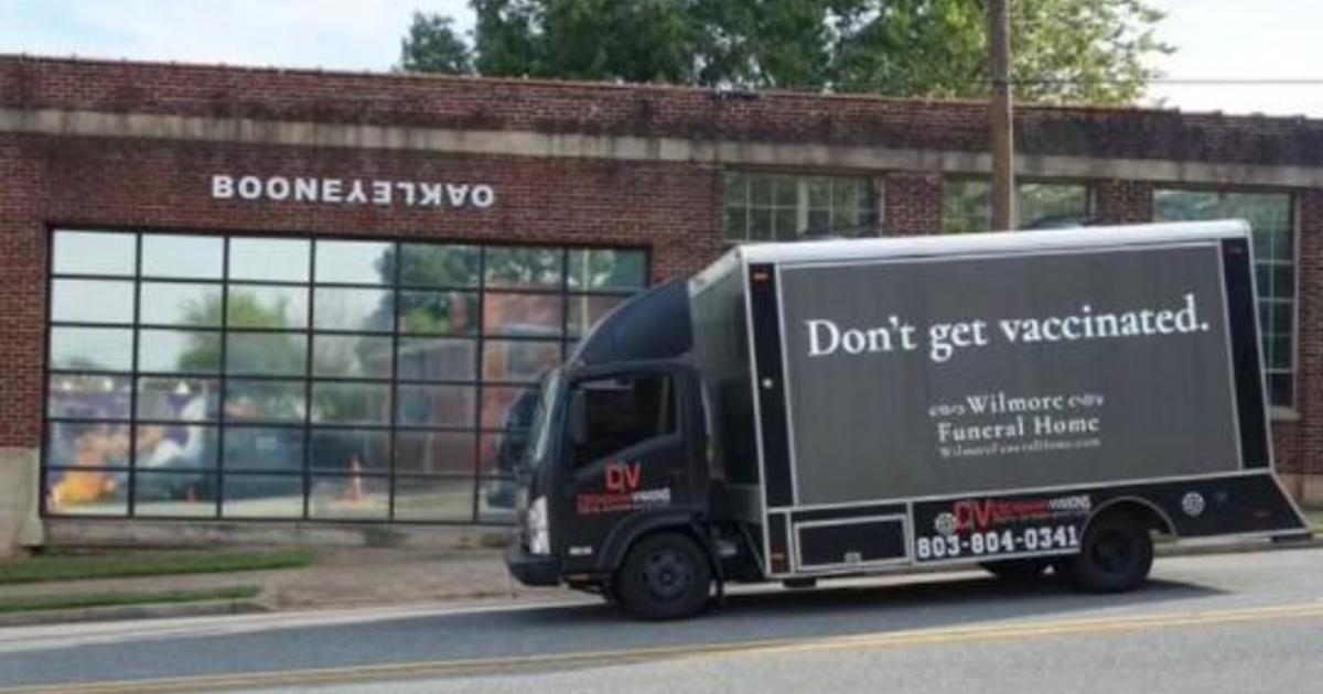 "Anti-vax" billboard on "funeral home" truck goes viral