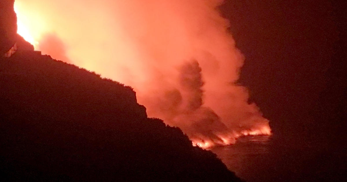 Spanish island residents warned to stay indoors as lava from volcano finally hits the sea