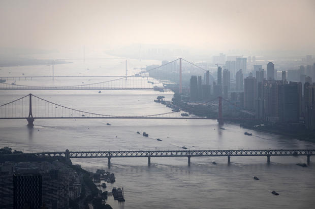 Bridges over the Yangtze River are seen from the Wuhan Greenland center during its construction August 11, 2020, in Wuhan, China. 