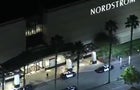 An image capture from aerial footage shows crews working the scene after a robbery at the Westfield Topanga Mall in the Canoga Park area of Los Angeles on November 24, 2021. 