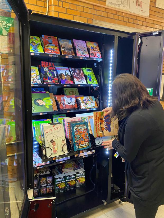 School rewards good behavior with tokens for book vending machine ...