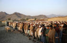 People pray during the funeral for a victim of an explosion in eastern Afghanistan near the border with Pakistan that killed nine children and wounded four, according to the office of a Taliban-appointed governor, in Jalalabad, Afghanistan, January 10, 20 
